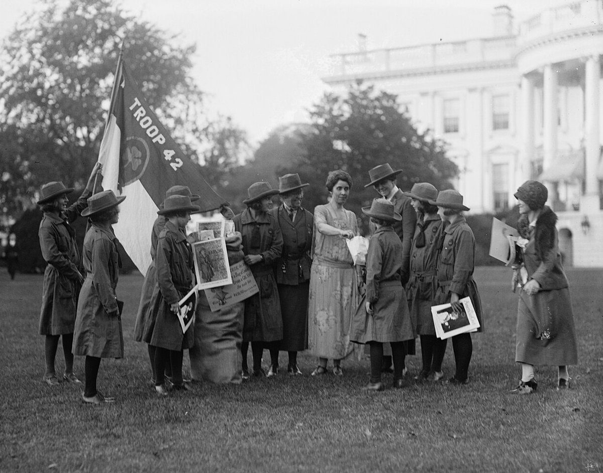 100YearsAgoNews's tweet photo. Oct. 17, 1923: First lady Grace Coolidge digs into a batch of Girl Scout cookies, a gift from Troop 42 from Washington, D.C., at the White House. The president's wife is also named honorary national president of the Girl Scouts, a volunteer role she will take on enthusiastically. https://t.co/tPV46o1gCT