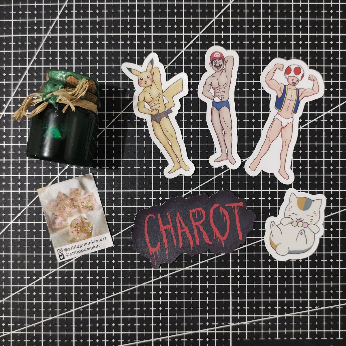 ikenleeee's tweet photo. @merllamas Section! Mis-macho stickers for "people of culture" by @hush_hush_art, the Charot and Dango cat is by @/pixel.key (IG), and the really cool D20 dice potion is by @stillapumpkin! Quite the assortment here! https://t.co/oqUwwI0ocR