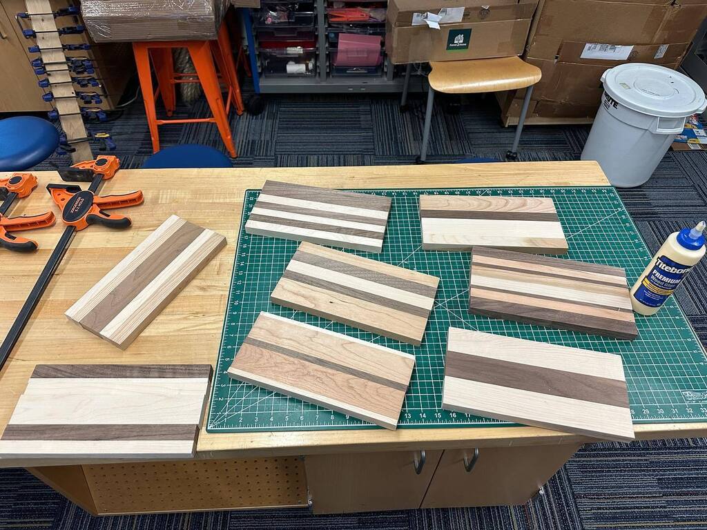 thenerdyteacher's tweet photo. It’s cutting board season! Students are putting together cherry, walnut, and maple boards in design class. Sanding, routing, and finishing are next. #MakerEd #KnightsForge @uniliggett https://t.co/x2513r1b5P https://t.co/pWGOK33yJG