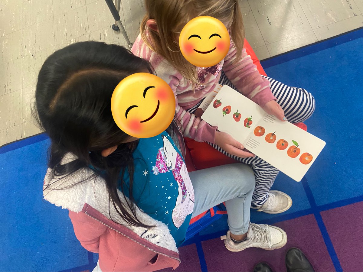 MissBoles's tweet photo. Just one day after the amazing GHS Spanish 5 students read bilingual stories to 2nd grade, I caught my newcomer who speaks Spanish and my English speaking student taking turns reading la oruga muy hambrienta/the very hungry caterpillar😍 #secondgrade #bilingualpower https://t.co/2n2FGQ3zh0