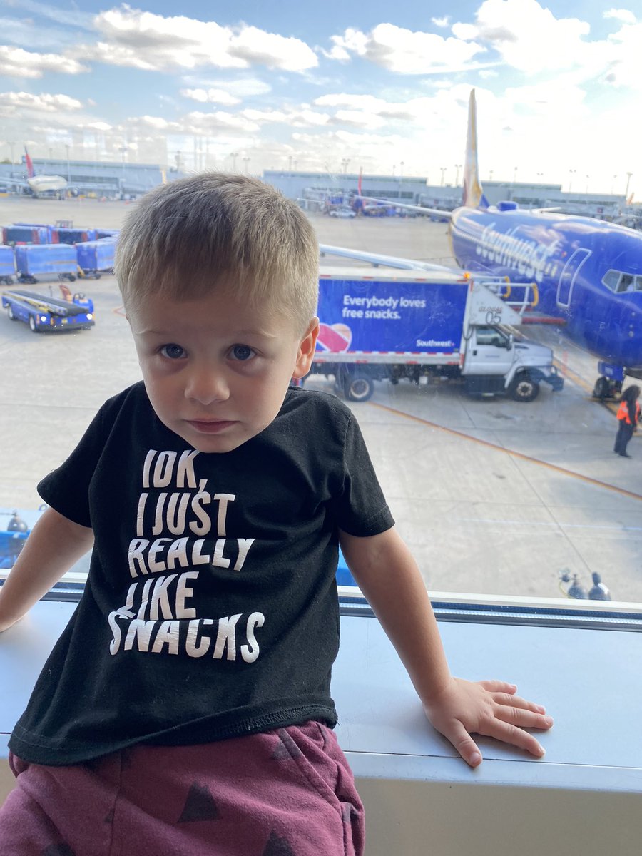 whittyt's tweet photo. @SouthwestAir  read the shirt! The kid really like snacks and the crew on flight 500 from MDW to MSY today hooked him up! Best Pilots and crew I’ve had on southwest!! THANK YOU!! You made traveling with this #snackmonster a breeze!! Here is the. poster child of your snack trucks! https://t.co/O8aiqjrRrt