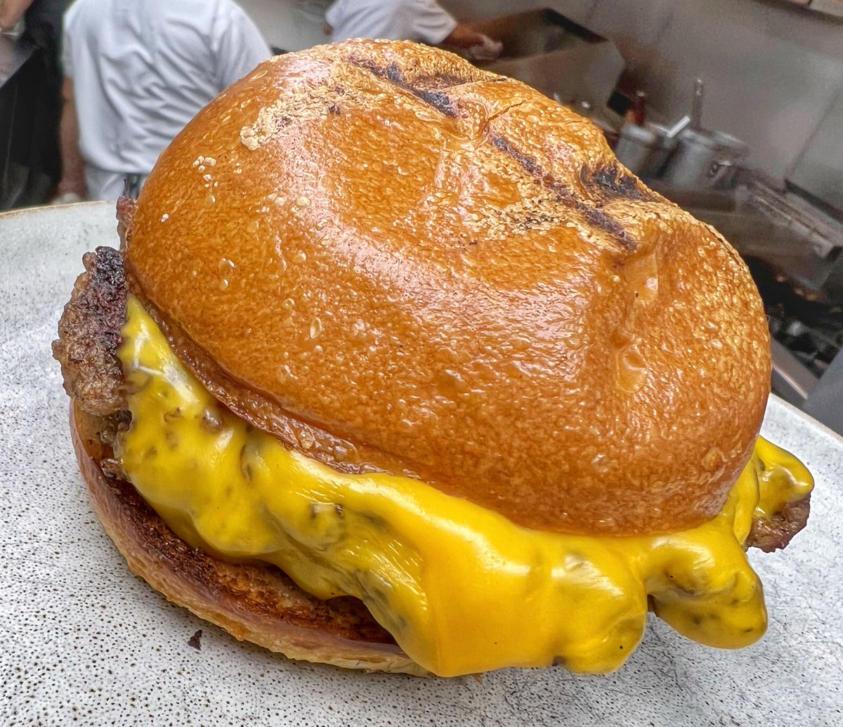 When I squeeze the bun on a burger I want to feel that hot brioche perfume hit my face from the interior. That’s our burger - Toasted, soft bun, buttery interior, meltingly tender burger, light cheese skirt, crispy beef edges.