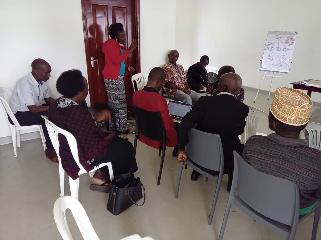Altus Consult (U) Ltd Local trainers (standing), training Local Leaders of Rwengaju Subcounty Farmers Cooperatives and Rwengaju Irrigation Scheme Water Users  Association on group dynamics, Leadership and governance at Rwengaju Irrigation Scheme in kabarole district.