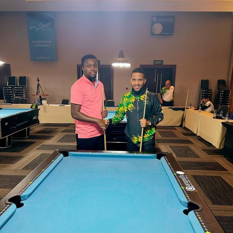 Mbogi_Yetu's tweet photo. In the true Base Yetu culture, the Ksh. 500,000 winner of the 2022 Base Yetu Pool Tournament David Mbuthi flying the Kenyan flag high at the 2023 All Africa Blackball Championships in South Africa. Competing on the global stage is a testament to the multiplier effect of Base Yetu's grassroots talent search and nurturing, and David's excellent effort. Kudos!