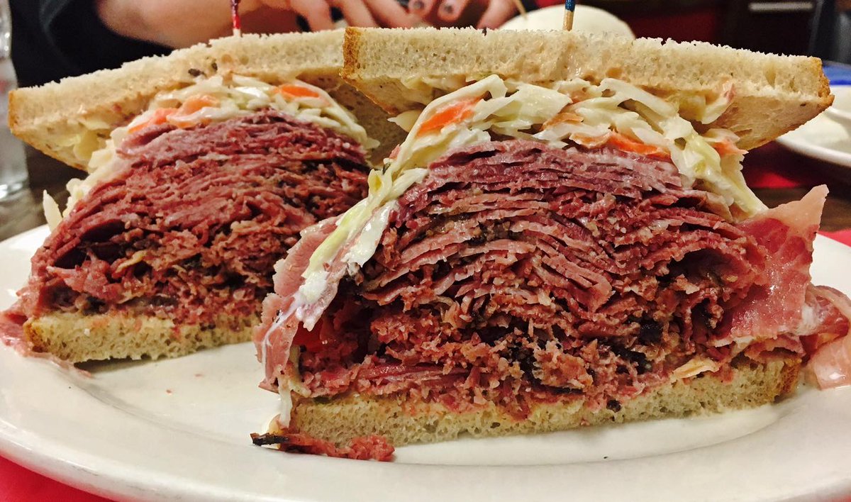 Hope you are hungry for a hearty lunch today! At @hobbysdeli, they take their pastrami stacked sandwiches very seriously. Download the NWKD app to order yours: newarkworkingkitchens.com 📸: @hobbysdeli