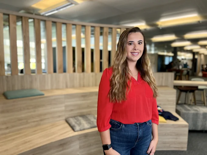DWP colleague stood in bright and modern working space.