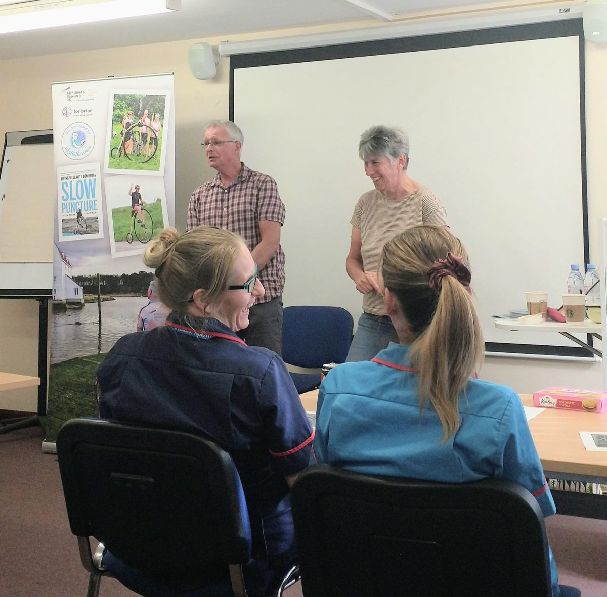 Something clearly tickled <a href="/PeterBe1130/">Peter Berry</a> &amp; me during today's talk at <a href="/IpswichHosp/">Ipswich Hospital</a>. Laughter, what a great panacea. <a href="/AlzAuthors/">AlzAuthors</a> <a href="/MedicAlertUK/">MedicAlert UK & IRL</a> <a href="/SNEEICB_IES/">NHS SNEE ICB - Ipswich and east Suffolk</a> <a href="/SNEEICB_WS/">NHS SNEE ICB - west Suffolk</a> <a href="/NHSuk/">NHS</a> <a href="/YoungDemNetwork/">Young Dementia Network</a> <a href="/SCCPublicHealth/">Healthy Suffolk</a> <a href="/Time4Dementia/">Time For Dementia</a> can't promise this much hilarity <a href="/dementia_summit/">dementiasummit</a>