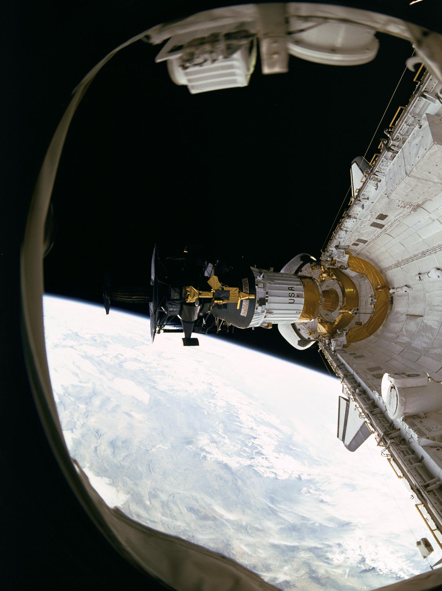 This photograph, taken by the STS-34 crew aboard the Space Shuttle Atlantis, shows the Galileo spacecraft being deployed on Oct. 18, 1989 from the Shuttle's payload bay. A portion of Earth and the blackness of space can be seen in the background.