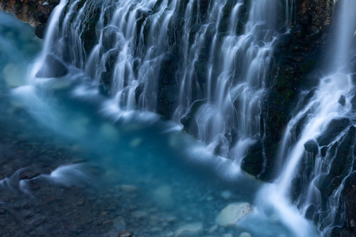 YamashitaPhoto's tweet photo. Shirahige no Taki (White Beard Waterfall): the aptly named source of the water in Biei’s Blue Pond. #shirohigenotaki #shirohige https://t.co/ipGFX2eY4q