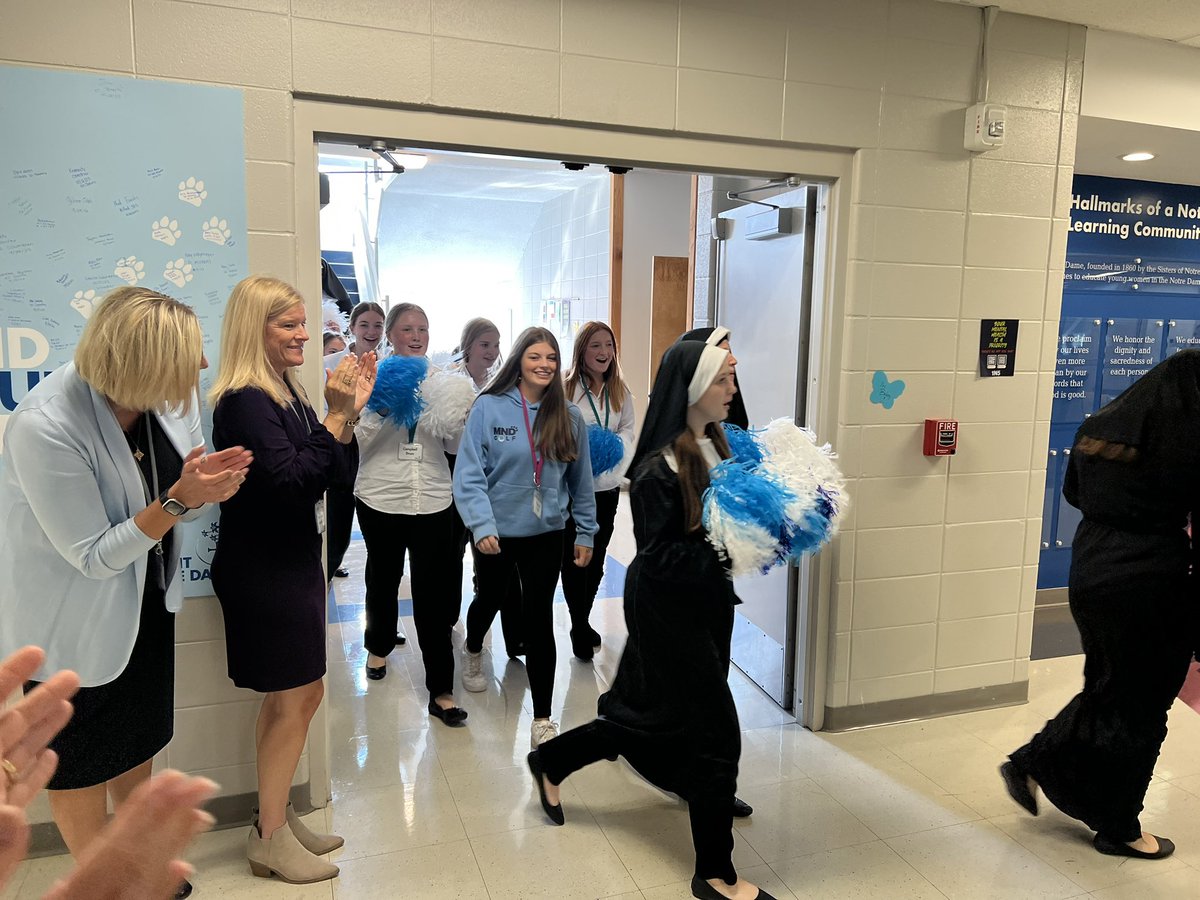 MNDAthletics's tweet photo. The MND State walk through tradition continues. Today, the entire school sent Mo Burns off to State! ⛳️ #GoCougars https://t.co/EG17Ze4u8J