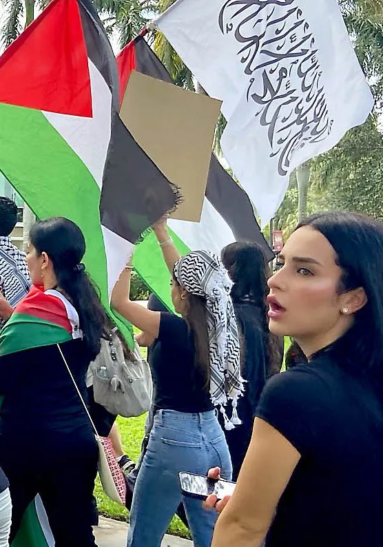 Yes, that’s a Taliban flag. How long would these women last in Afghanistan?