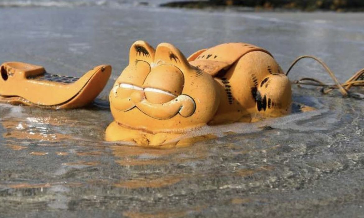 Garfield phones have been washing up on the Finistere coasts of France for nearly four decades, with a shipping container wedged in the rocks that has been slowly releasing them all these years.

The peculiar phenomenon began in the 1980s when bright orange fragments of Garfield