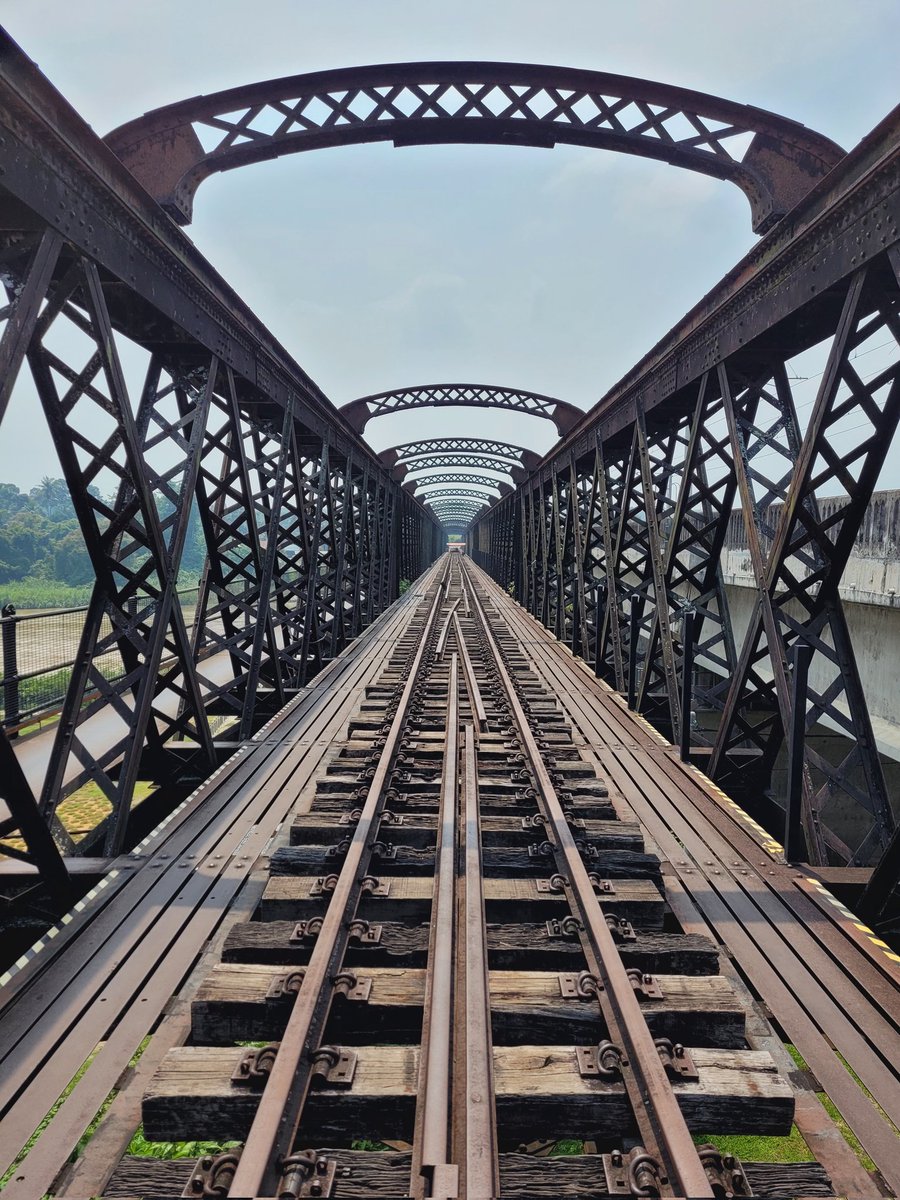 Walking across the old railway bridge over the Perak River. With its crumbling sleepers and rusting ironwork you need a head for heights. 
Constructed by the British in 1897, it's beginning to show its age #VictoriaBridge #straightlines #railway #bridge