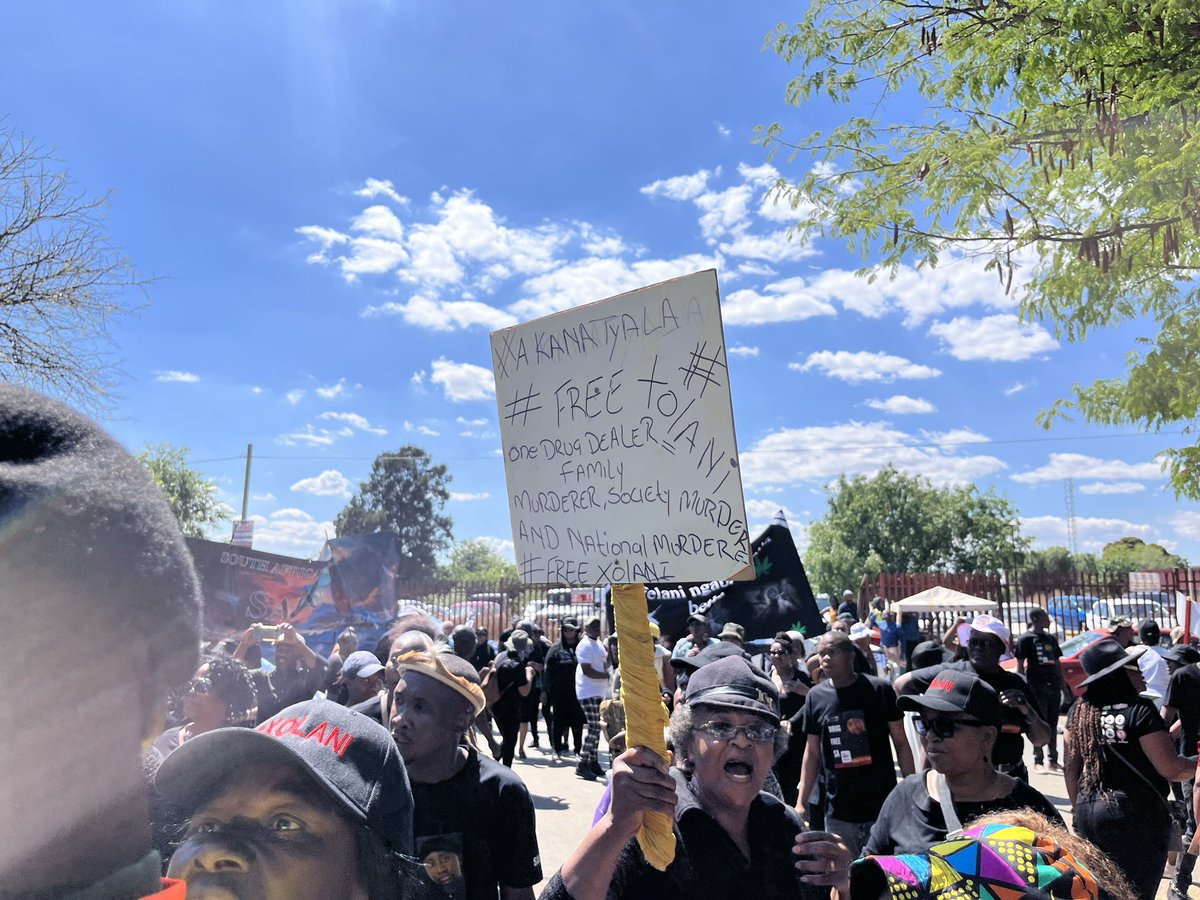 ewnreporter's tweet photo. Xolani Khumalo, presenter of the drug busting TV show called Sizokuthola, is back at the Palm Ridge Magistrate’s court where he stands accused of killing Robert Varrie. 

About two hundred people are stationed outside the court to support him. TCG https://t.co/MCIev9dd2R