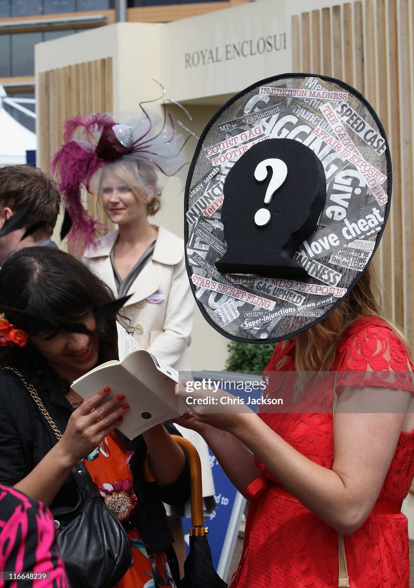 A woman wears a superinjunction hat on Ladies Day at Royal Ascot at Ascot Racecourse in Ascot, United Kingdom.