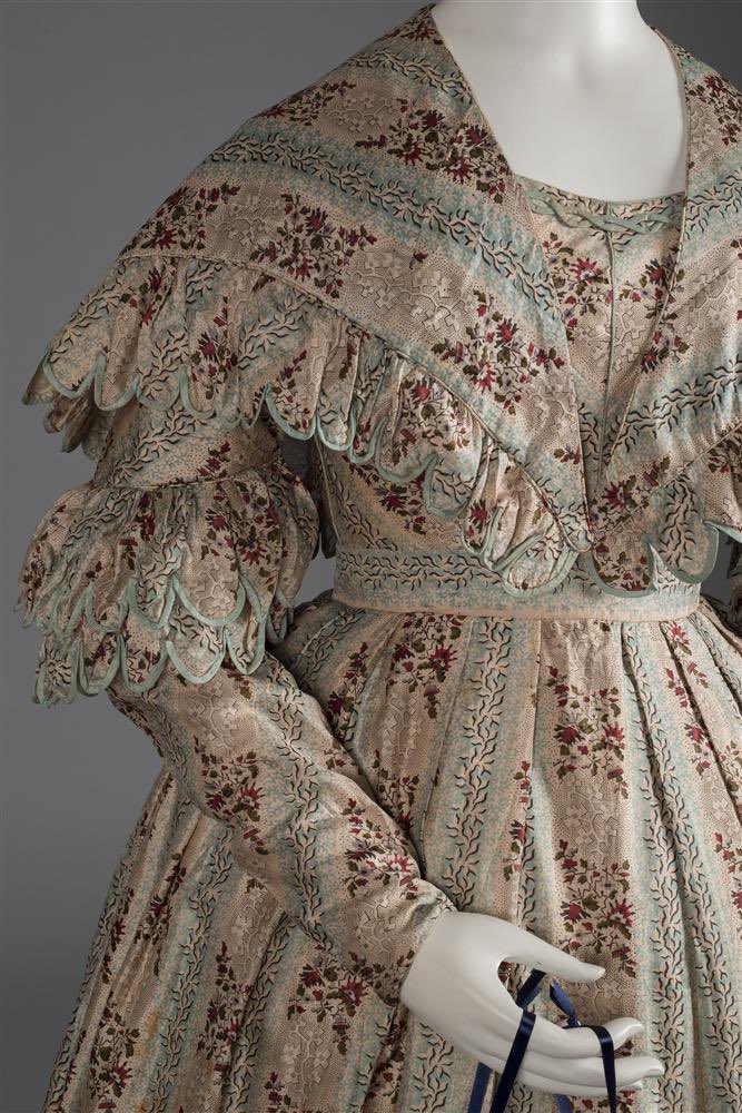 kateStrasdin's tweet photo. I can only imagine the hours that were required of these satin trimmed scallop edges that swoop their way across the outlines of this late #1830s gown. Chosen to compliment the palette of florals it is a subtly effective addition @TheWadsworth #fashionhistory https://t.co/FUaCltwjVM