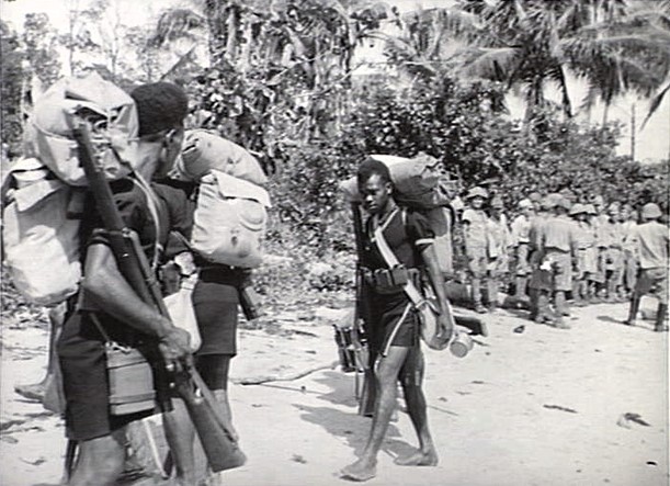 New Guinea
Oct 19 1945:
Almost seven weeks after Japan's surrender at Tokyo Bay, the Royal Papuan Constabulary land on the beach of Lossuk Bay, Kavieng to take command of the area from the Japanese occupation force - 500 men of the Maizuru 2d Special Naval Landing Force, at rear.