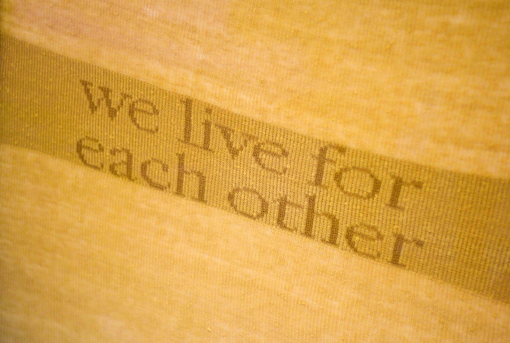 The message of We Live For Each Other is reflected in the choice of medium in which the interlacing knitted yarn represents the connecting strands which bind people together. Beyond the utilitarian, knitting is a social tradition which is deeply entrenched within communities.