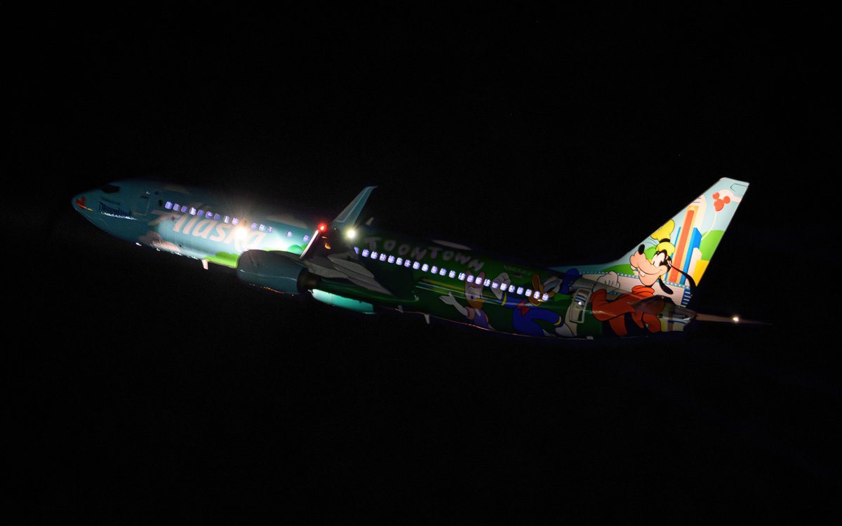 sporky22's tweet photo. N565AS leaving GEG tonight with a new Mickey Mouse Toontown/Disneyland livery #N565AS https://t.co/BBN3gIUSja