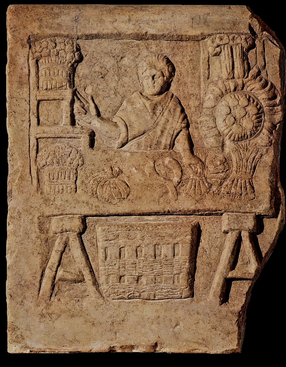 For #ReliefWednesday a #Roman representation of everyday life: A relief from #Ostia, depicting a vegetable and flower seller behind a stall, showing off an array of products on the table. 

Dating late 2nd/early 3rd century AD.

📷Archaeological Museum Ostia