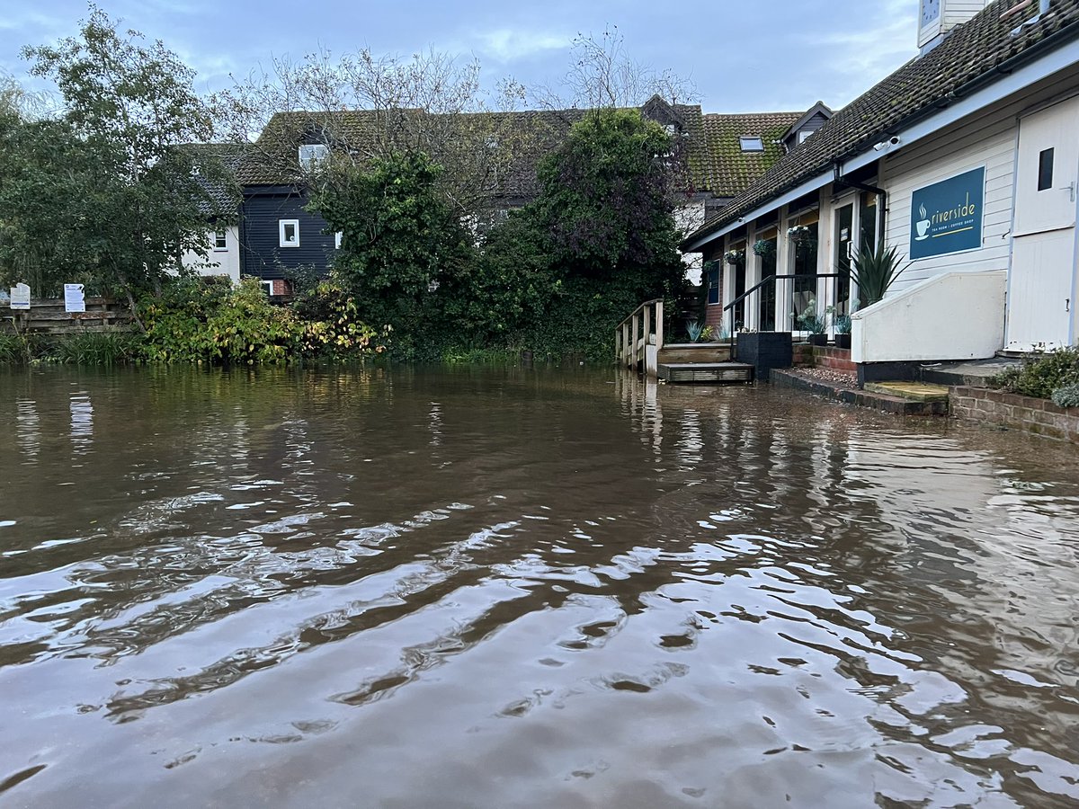 SJB394's tweet photo. It’s a bit wet and flooded outside the businesses at the moment. The rain is not helping, but it’s mostly because of the crazy high tides in Wroxham 💦 https://t.co/J6ZOkrhgCV