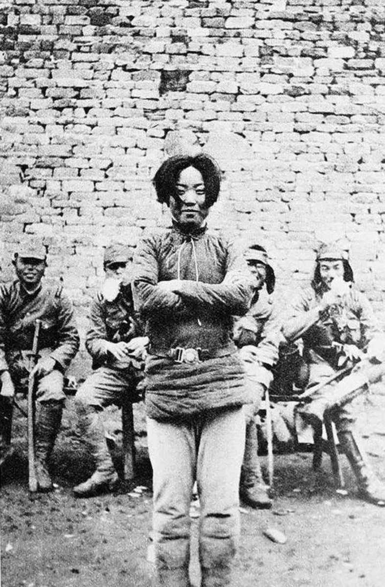 Photograph of Cheng Benhua moments before her execution by bayonet. She led a Chinese guerrilla movement against the Japanese during the invasion of her country before being captured in 1938. In captivity, she was cruelly tortured by interpreters and gang raped by several guards.