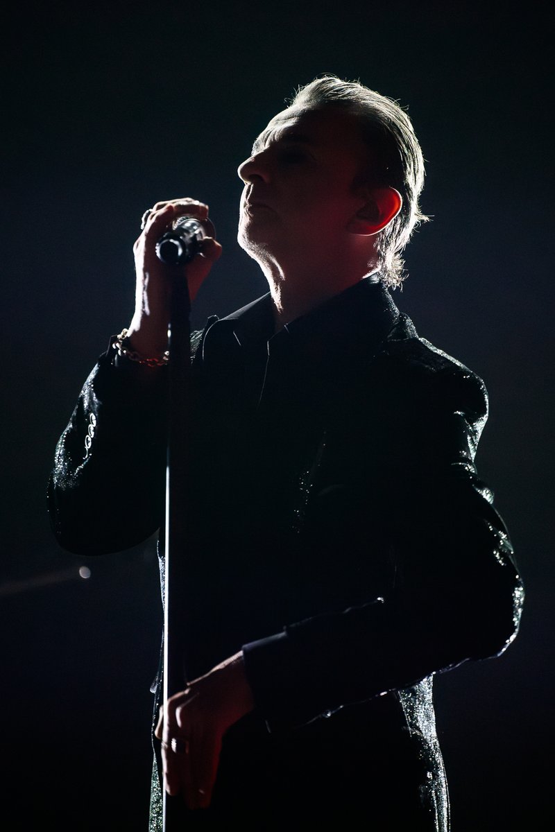 In live music, I love the quiet moments as much as I love the loud ones. The moments that are easily passed over. The times in between. The ones that feel fleeting and timeless all at once. 

Dave Gahan of Depeche Mode.