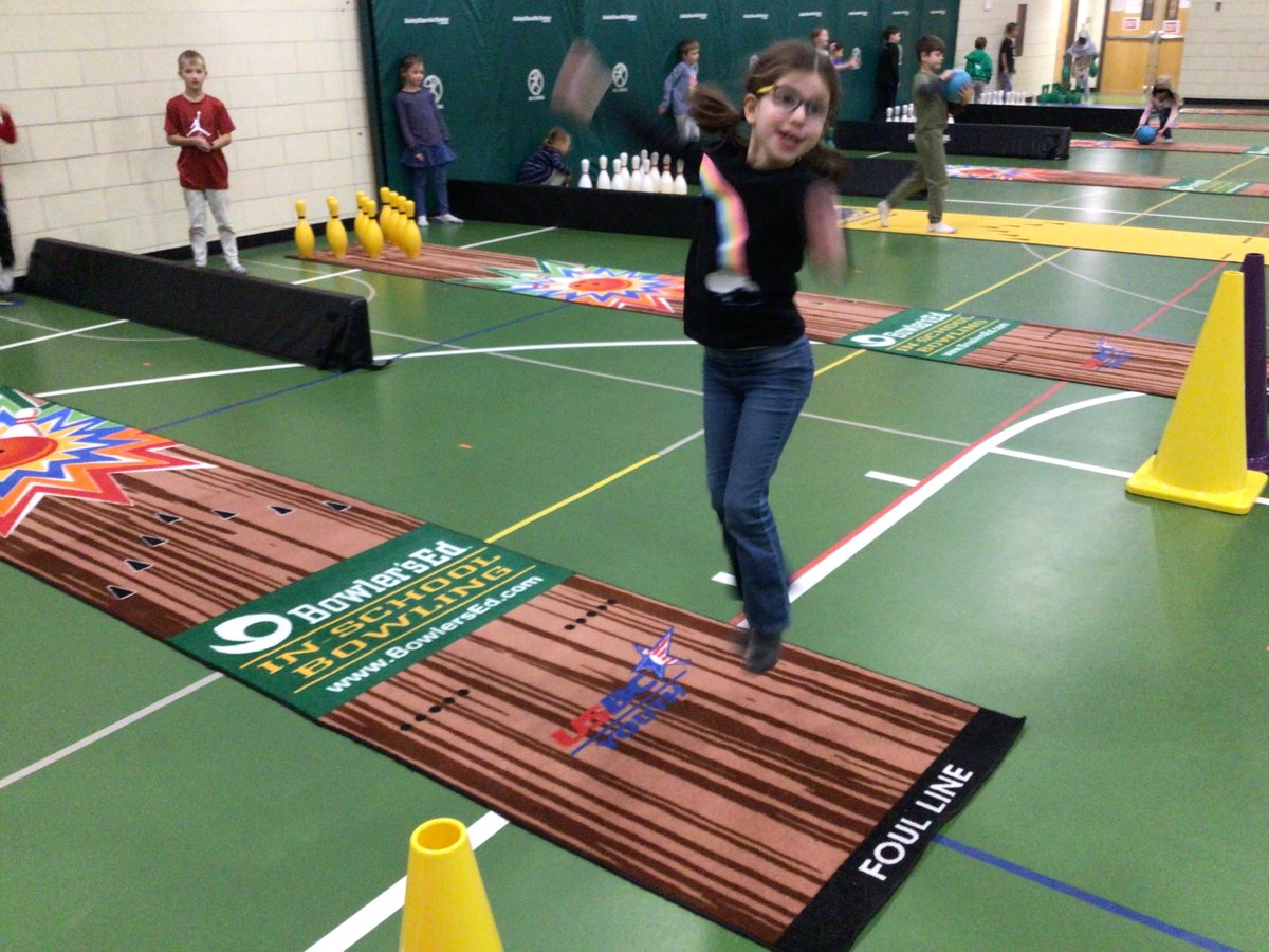 Excitement of a strike in PE Bowling.