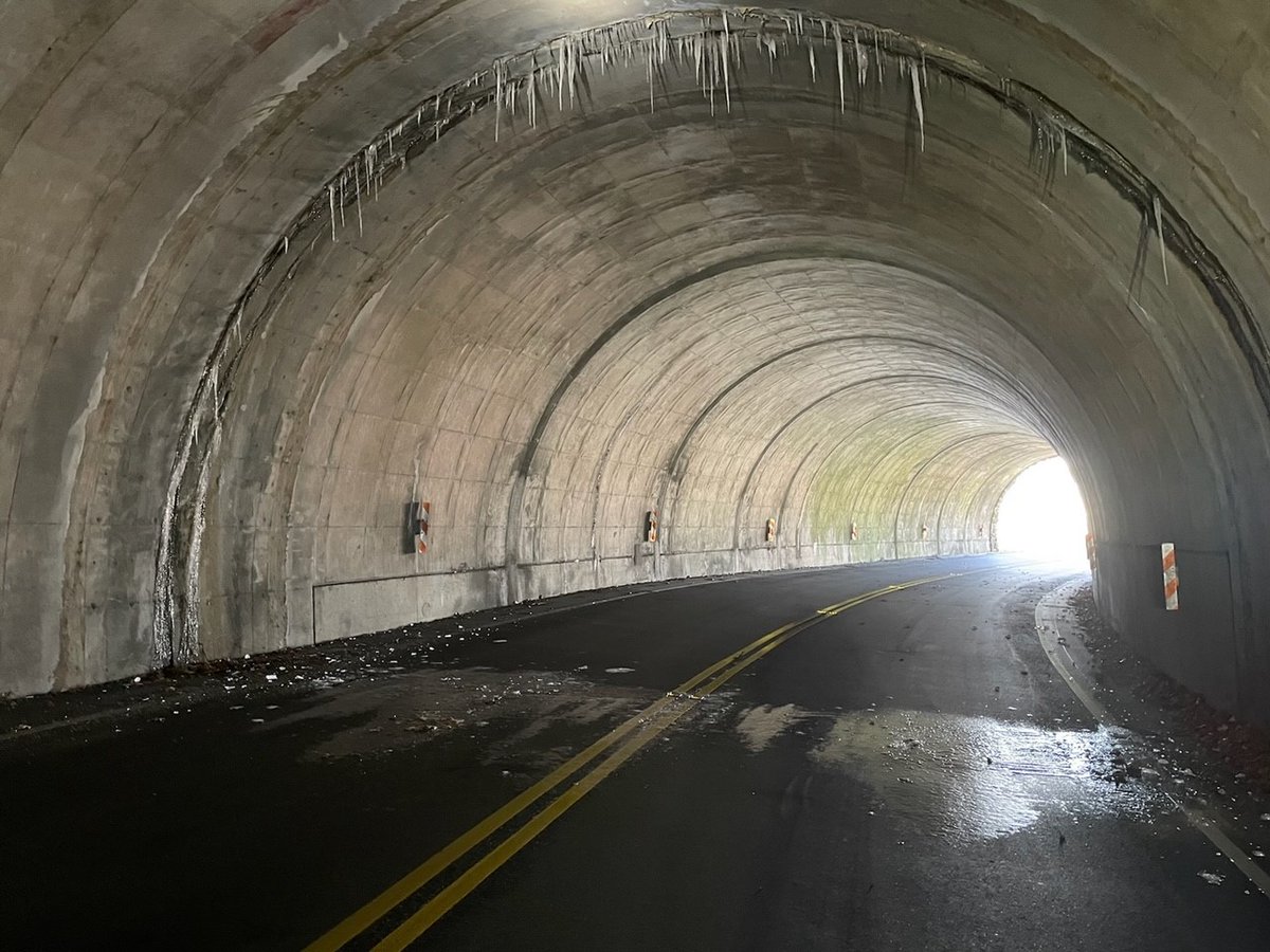 One day it's 'Boo!' and the next day 'Brr!' Park staff are closing gates from MP 458-469 due to ice. Stay safe! NPS Image - Despite sunshine at one end of a the tunnel, ice formations in a tunnel interior hang over a large patch of ice covering the road.