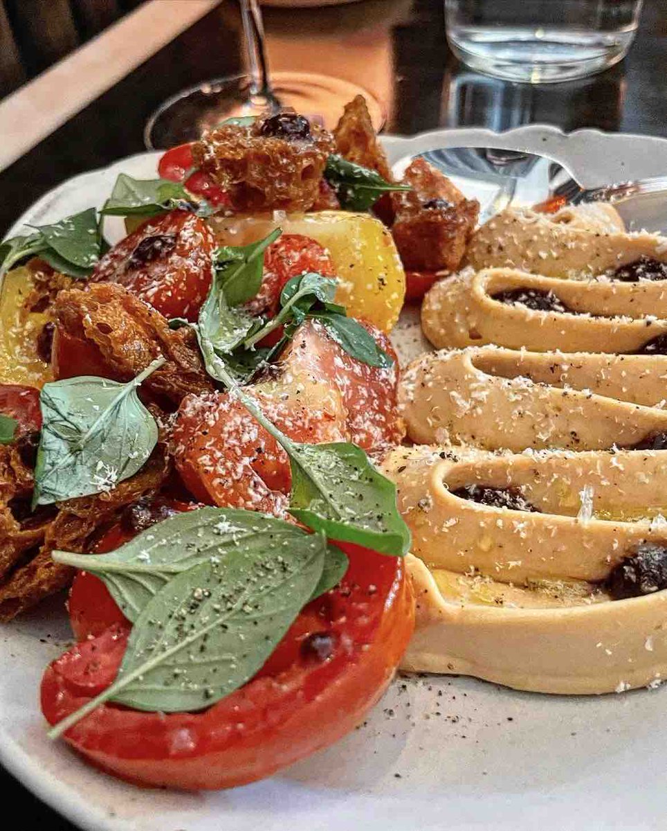 Heirloom tomato panzanella with tomato curd, Thai basil and goat cheese. Tap here to try it today: gwenla.com