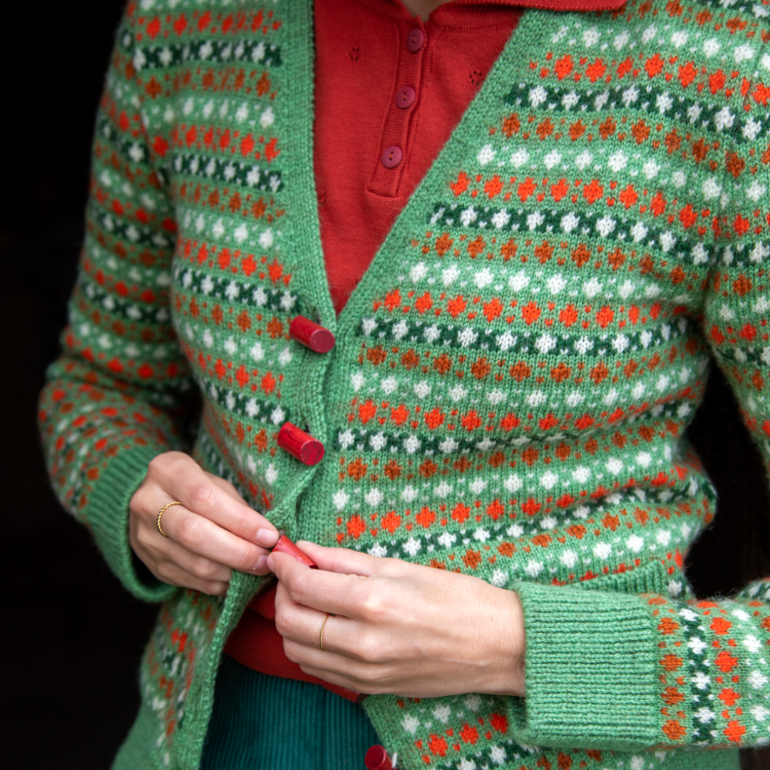 We love the little wooden lipstick buttons on our Popcorn Heritage Knit. They have a unique cylindrical shape that adds a touch of pazzazz to this one-of-a-kind knit.