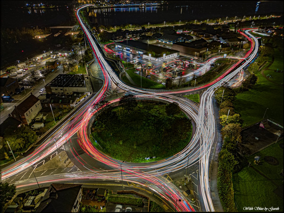 CRy3Gen's tweet photo. Capturing the vibrant pulse of Llandudno Junction flyover with  mesmerizing light trails! 🚗✨ Embracing the beauty of long exposure  drone photography. #LlandudnoJunction #LongExposure #DronePhotography  #LightTrails #NightCapture 🌌 https://t.co/jYB4e4jygZ