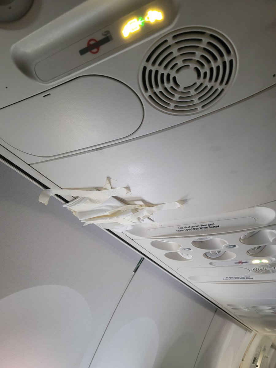 bareidos's tweet photo. Hi @delta and Ed Bastian. Today's  flight to Atl from DTE didn't go as planned. 2 hours and still stuck on the tarmac. The plane carries signs of lack of maintenance with sealed off overhead bins that cannot close, a water leak fixed with tape and napkins  and engine issues... https://t.co/igJEdMqhi3
