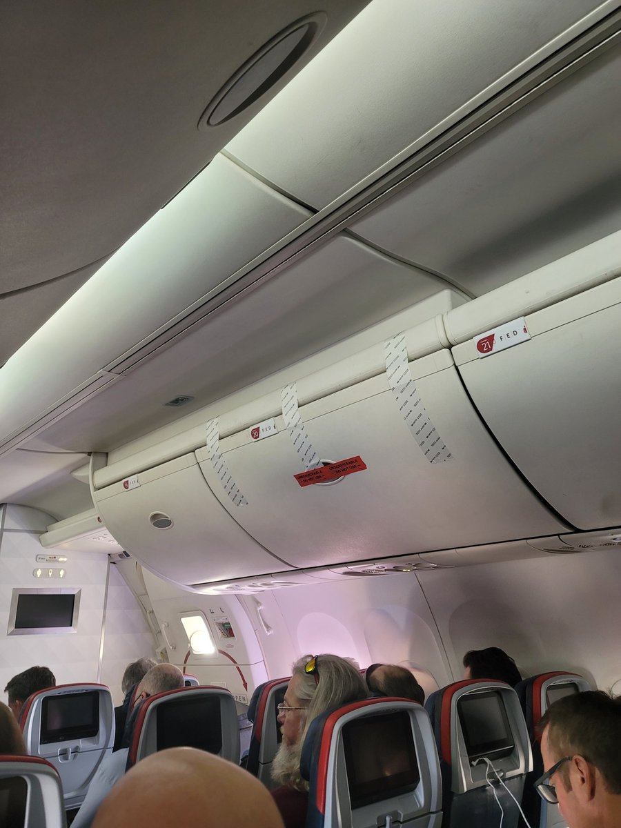 bareidos's tweet photo. Hi @delta and Ed Bastian. Today's  flight to Atl from DTE didn't go as planned. 2 hours and still stuck on the tarmac. The plane carries signs of lack of maintenance with sealed off overhead bins that cannot close, a water leak fixed with tape and napkins  and engine issues... https://t.co/igJEdMqhi3