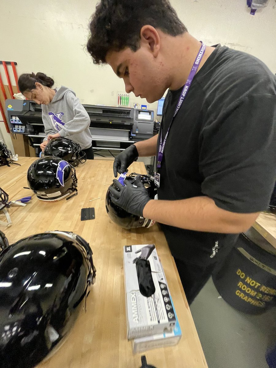 KropCTE's tweet photo. Our Communications Technology students designed, printed, cut, and adhered new custom decals for our @KropFBTwitr team’s helmets! This is the exact same process as done in the #NFL . Great job! Can’t wait to see them in action on Friday night! #GoLightning #YourBestChoiceMDCPS https://t.co/idxm95d8Wn