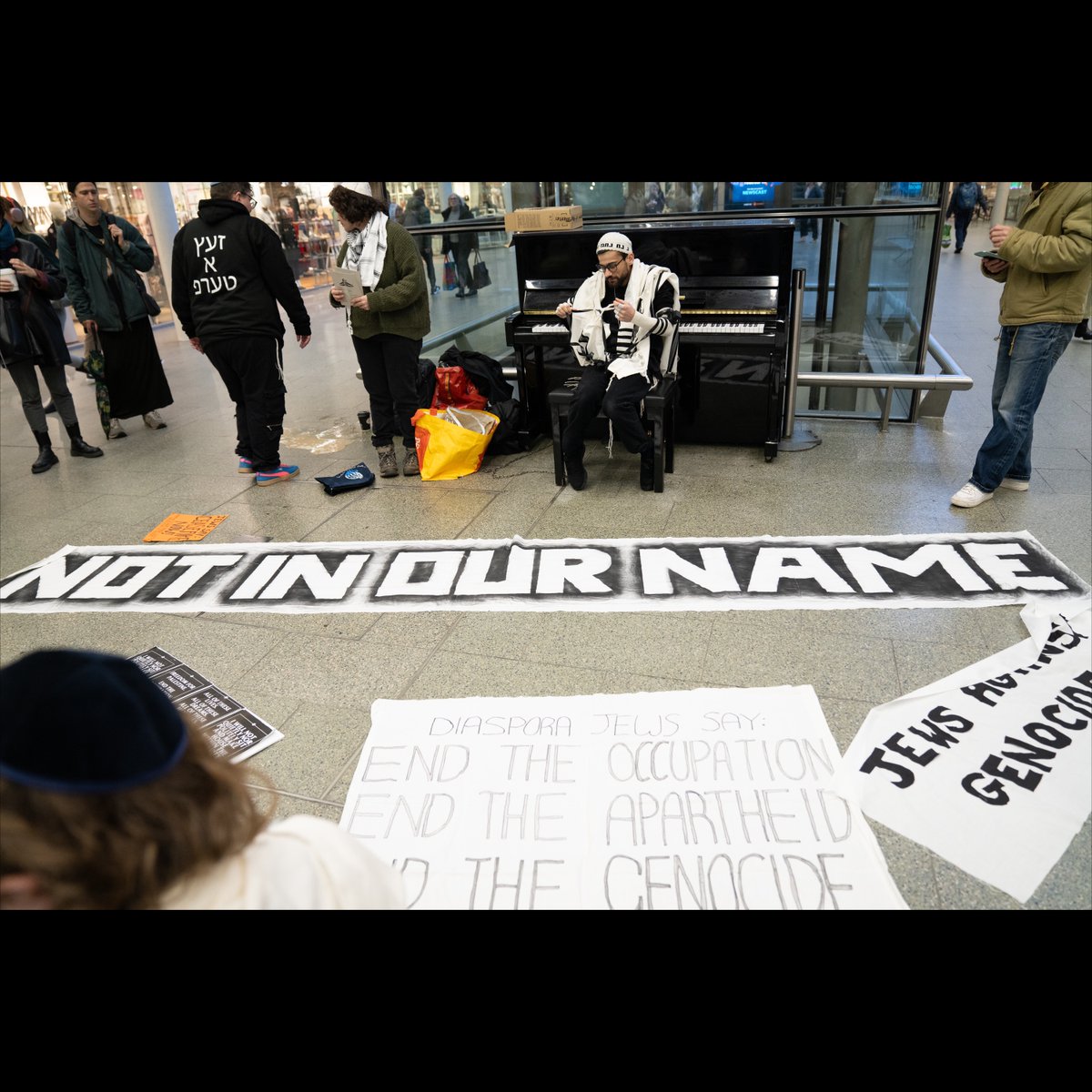 novaramedia's tweet image. Jewish anti-Zionists are leading a morning prayer service at St Pancras train station in support of Palestine.  

The service is being led by Jewish Anti-Zionist Action, a coalition of Jewish people based in the UK.