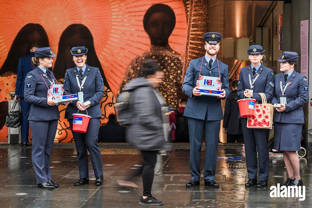 RAF personnel sell poppies at Brixton station - The Royal British Legion London Poppy Day in front of Rebirth of a Nation a new artwork by Jem Perucchini for Art on the Underground.

Image ID: 2T50018 // Guy Bell // Alamy Live  News   
Explore more here: bit.ly/3po8fJM