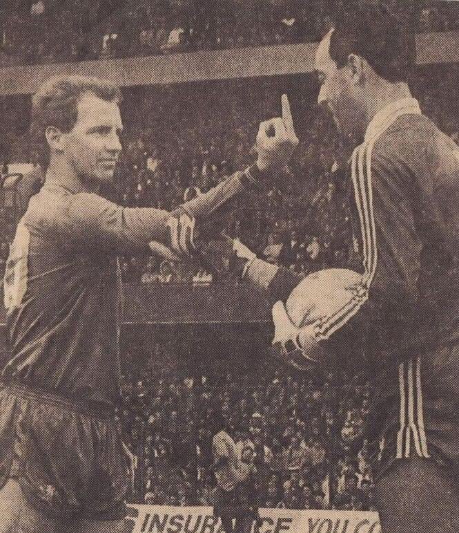 David Speedie Vs Bruce Grobbelaar. 

The pair would later go on to be teammates for Liverpool.F.C