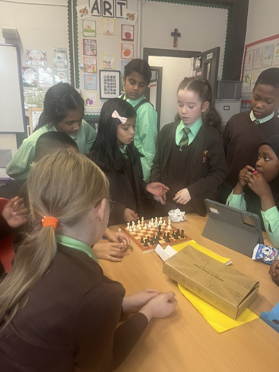 Chess Club is well under way in the P5 classroom. Today A is teaching the group all about the King 👑 ♟️ <a href="/St_Denis_PS/">St Denis’ Primary</a>