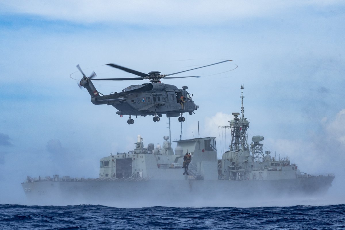 What a stunning action photo of a CH-148 Cyclone conducting wet hoist training operations during Exercise SAMA SAMA in the Philippine Sea on 11 October 2023. Photo: Cpl Alisa Strelley, #CAF