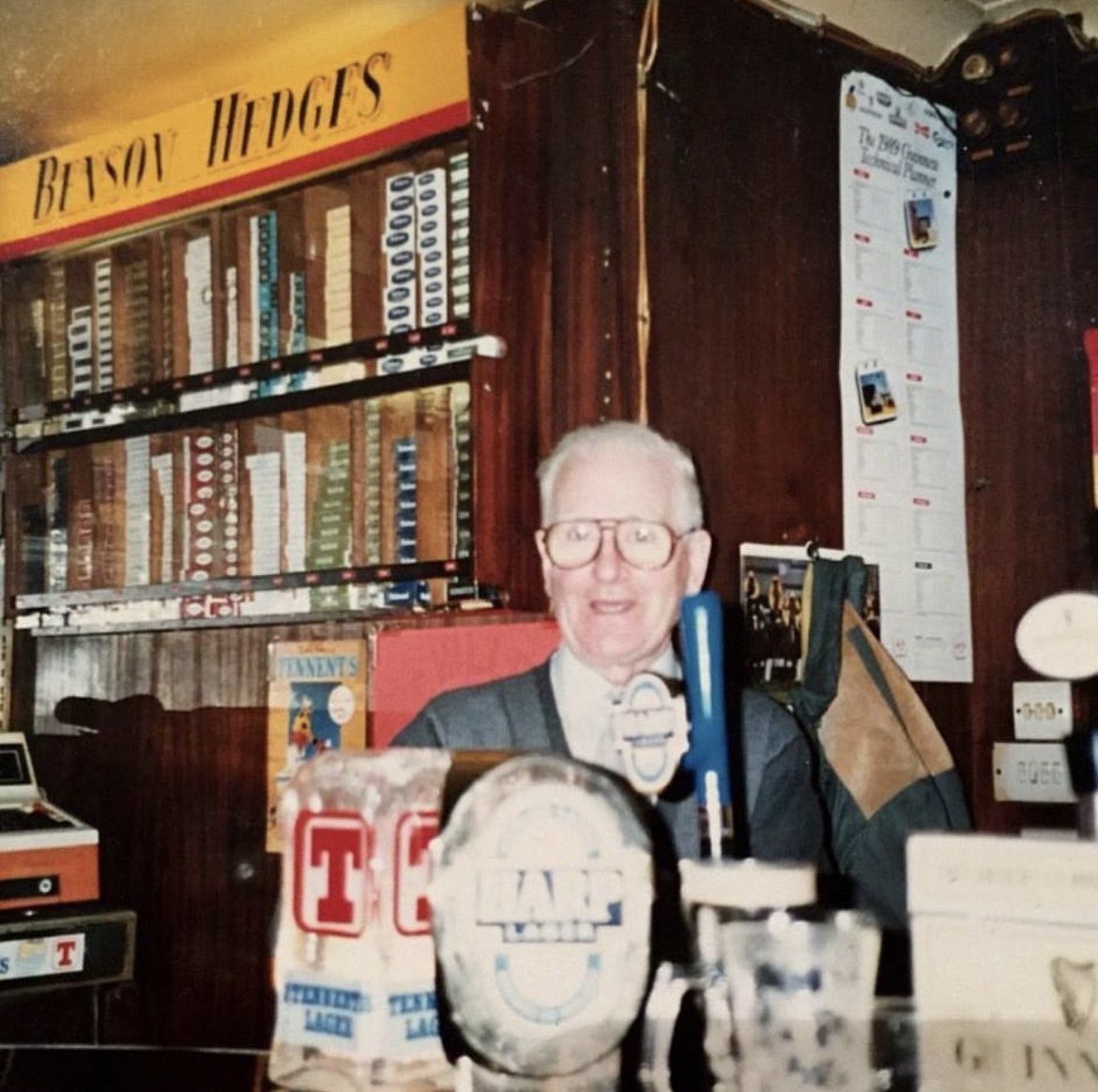 seanbeing's tweet photo. @publinie @RedgmanNyc My grandparents’ pub was O’Gorman’s on Main Street in Cavan town. Here’s my grandad Eddie behind the bar. Great childhood memories of getting a bottle of Cavan Cola and pack of King crisps every time we called in! https://t.co/ZQp9FeZakq