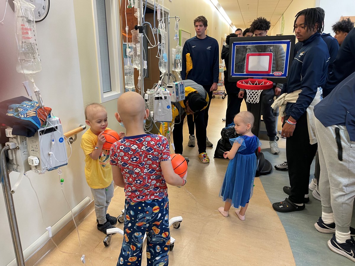 13abc's tweet photo. University of Toledo basketball players visited patients at the ProMedica Children's Hospital on Thursday 💙💛 https://t.co/gsC4n4NzK8