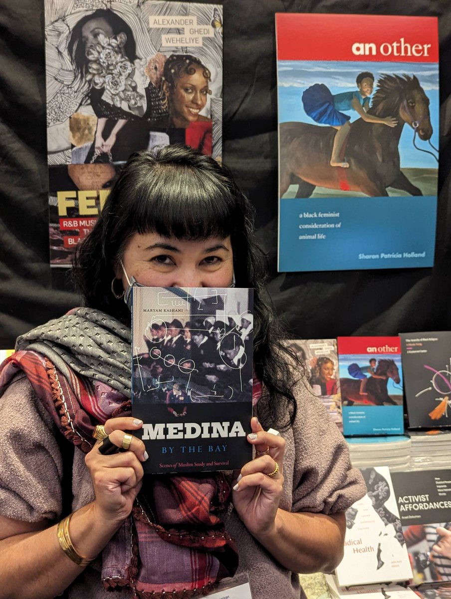 DukePress's tweet image. Maryam Kashani @myrmuring holds her book Medina in the Bay #2023asa