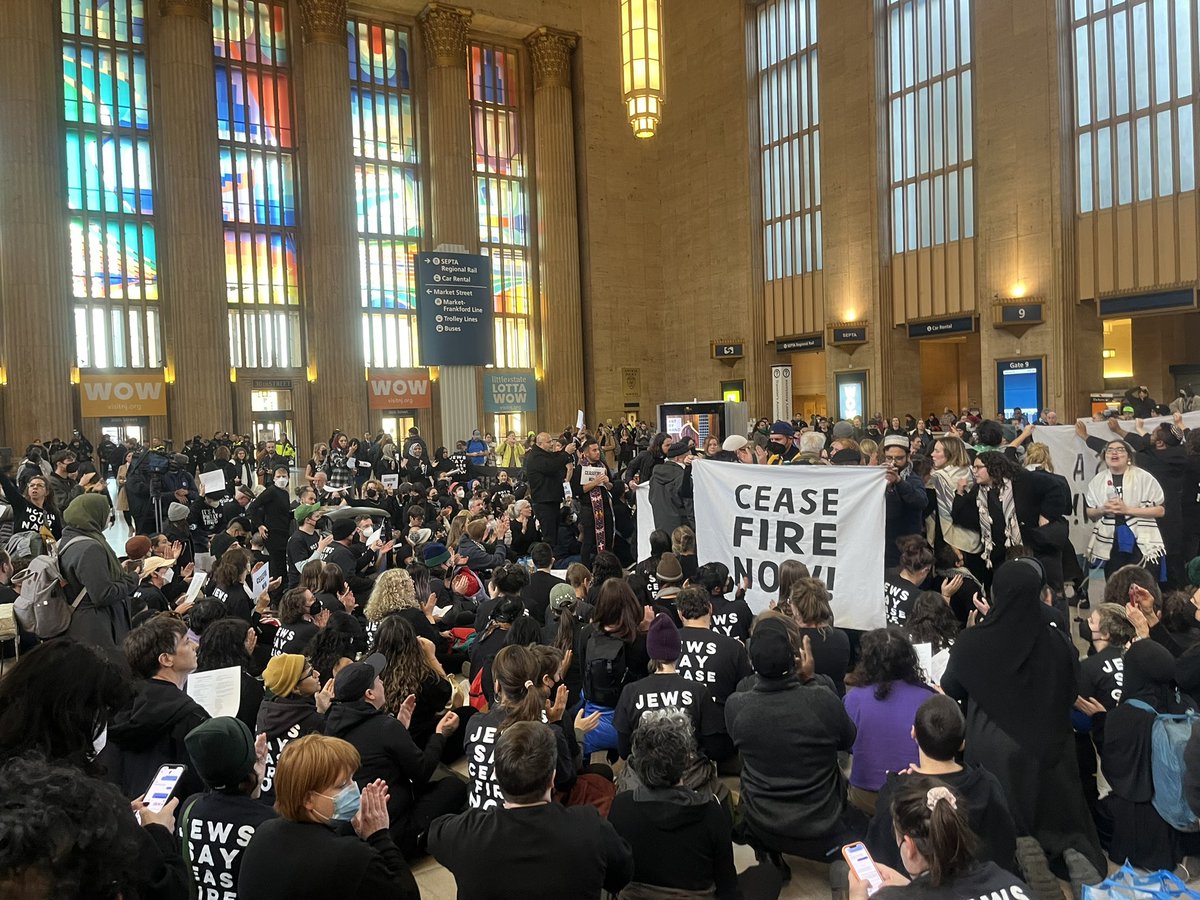 Over 200 demonstrators just started at sit-in 30th Street Station in Philly, waving with huge banners saying “CEASEFIRE NOW” for the rush hour crowd. Large police presence is on scene.