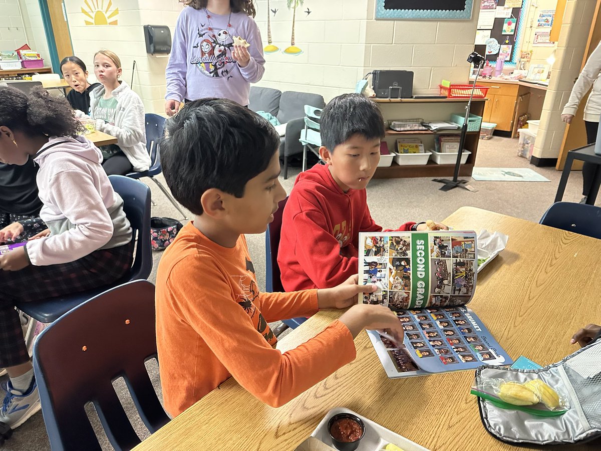 PTSquadTweeters's tweet photo. How can we, as #PawTechSquad members, help @MrsRiddileReads make our yearbook awesome!? 6th graders had fun looking through previous yearbooks to get ideas for what they can add to this years @PoplarTreeES! #HowCanWeHelpYou? #PBLinFCPS https://t.co/7U4OYNXQam
