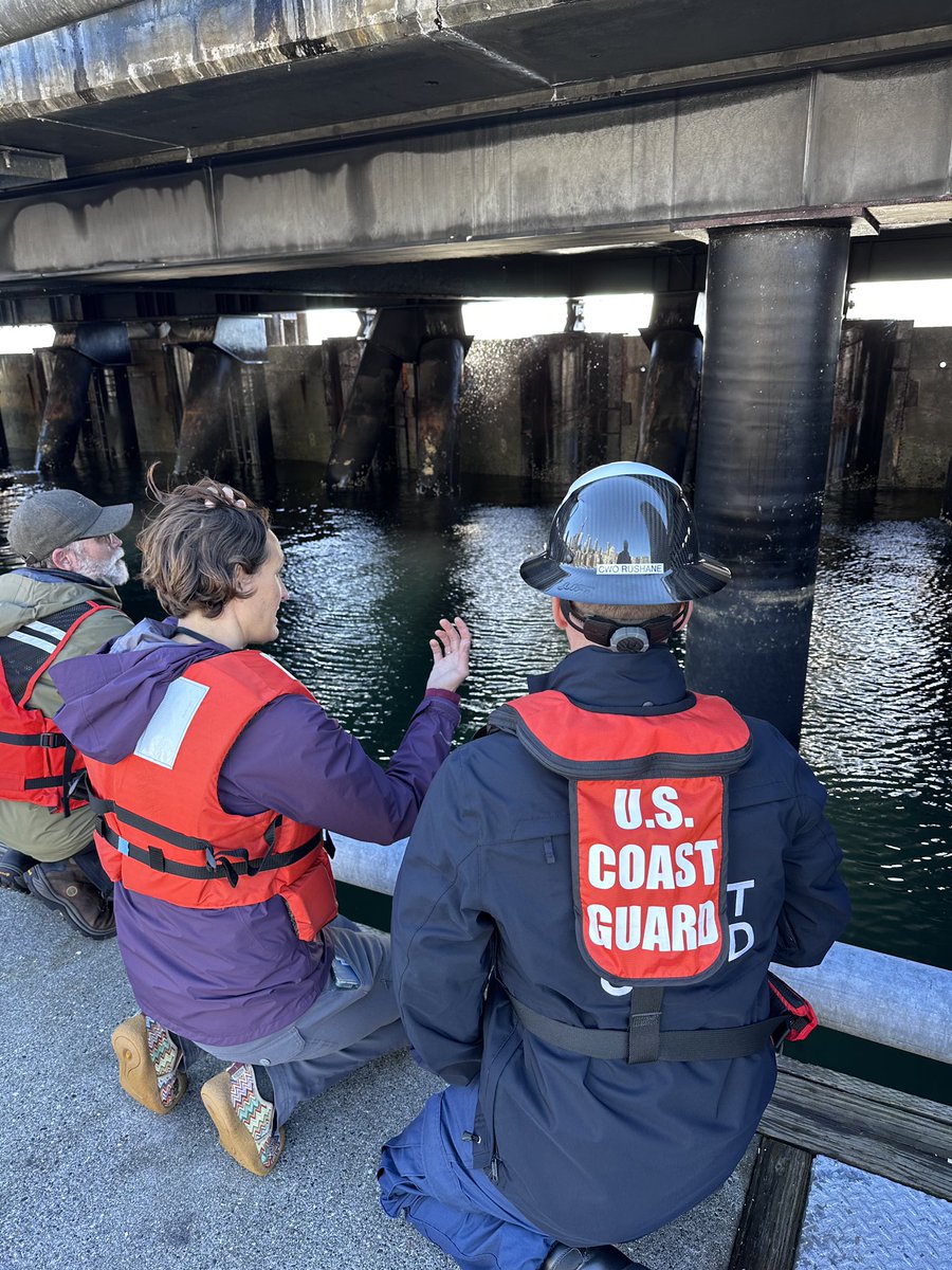 USCGNorthwest's tweet photo. #BREAKING #USCG notified at 1:25 p.m. of a barge that drifted from Terminal 18 towards Pier 66 in Elliot Bay. 3 tug boats obtained control of the barge. It was placed in tow and is being transported to Terminal 115. No reported injuries or pollution. Damage to Pier 66 reported. https://t.co/qhA8bR26pU
