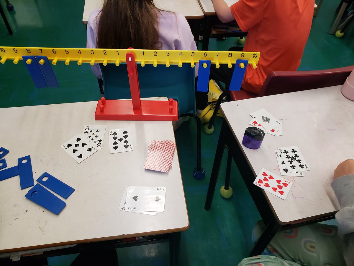 Students in grade 5 @sambro_ses were playing a game to practice making balanced equations. Each partner can use 1, 2 or all 3 of their cards to make an expression with the same value as their partners expression. Then they check to see if their expressions balance. #HRCEmath