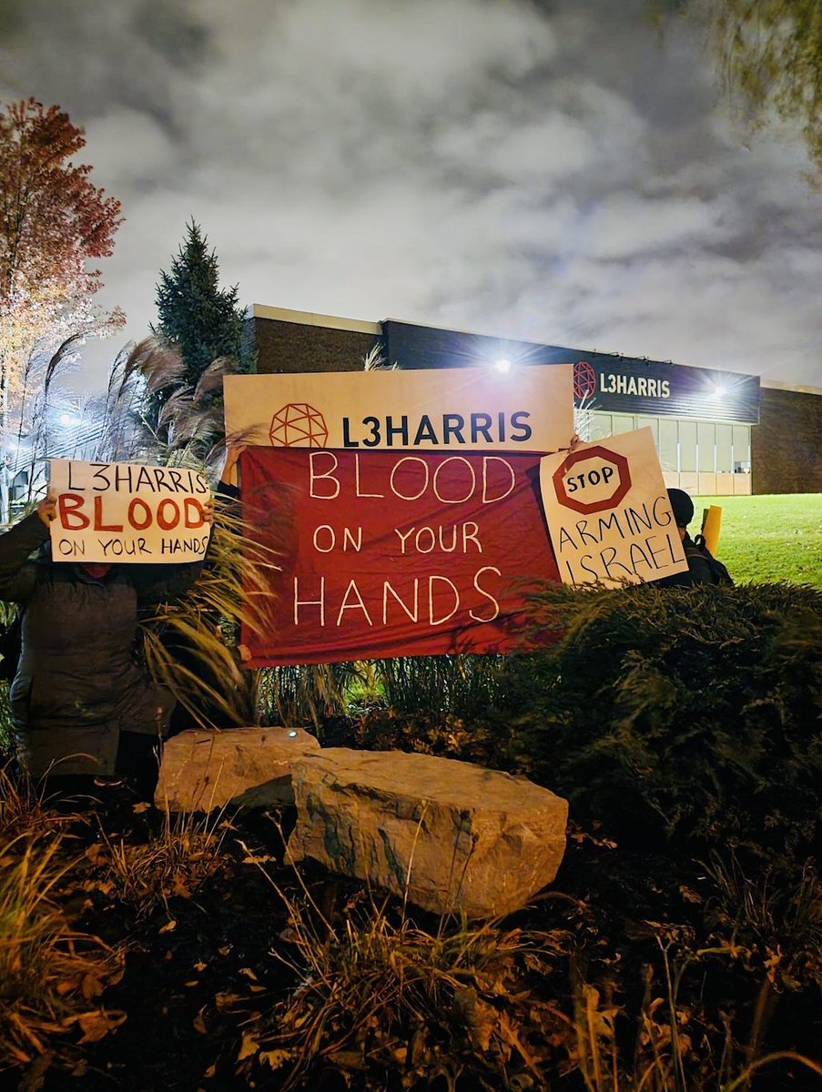 WBWCanada's tweet photo. BREAKING: Activists just covered the entrance to a Toronto weapons facility with 'blood splatters'. @L3HarrisTech makes vital components for many of the weapons systems used by the Israeli military, including the air-to-ground bombs falling on Gaza right now. #StopArmingIsrael https://t.co/iEvULTO24s