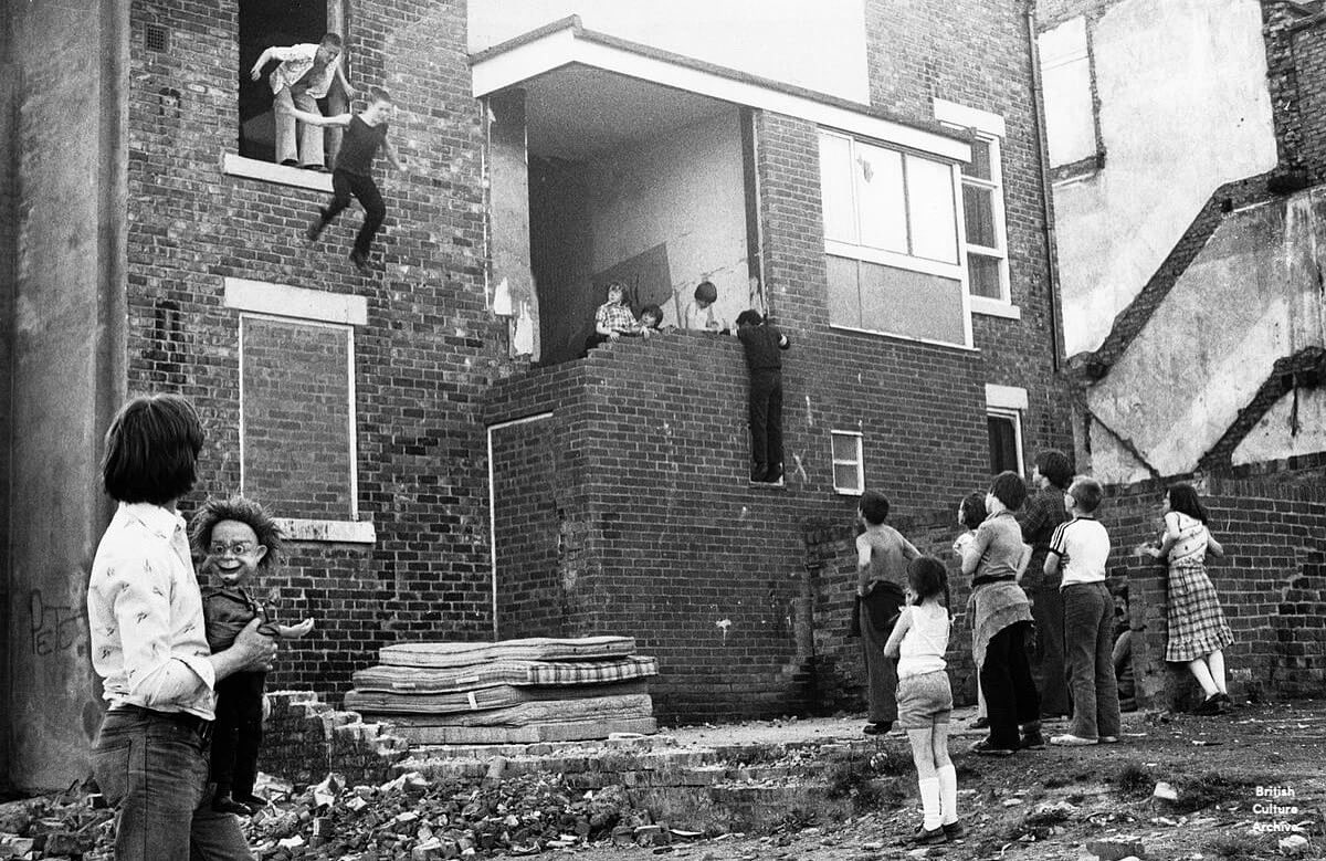 Kids Jumping onto Mattresses. From the series Youth Unemployment (1981) by Tish Murtha. Photo © Ella Murtha, all rights reserved.