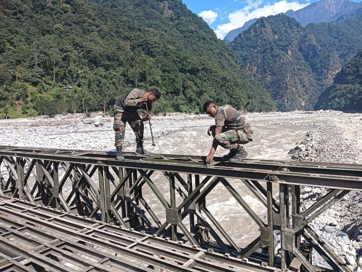 trishakticorps's tweet photo. “On the Path Towards Rebuidling Sikkim : Indian Army Sappers and Border Roads Launch Bridge accross the Teesta”

As part of continued efforts to rebuild & reconnect affected areas in North #Sikkim, Army Engineers of #TrishaktiCorps along with BRO and civil administration commenced construction of two bridges at Mangan to open up alternate route Mangan-Sanklang-Chungthang. Working on a war footing, the troops completed construction of the first bridge of 150 feet length on 22 Oct. 

The second bridge is likely to be completed by 27th Oct. This will enable vehicle move between Mangan and Chungthang, thus restoring connectivity upto Lachung valley that was cut off since 4 Oct.

The exceptional skill, unparalleled resolve, dedication to the task & unwavering commitment displayed by the troops has restored hope in the hearts of the affected communities that normalcy will be restored soon. 

INDIAN ARMY FOR THE PEOPLE : ALWAYS AND EVERYTIME!!!
JAI HIND AUR JAI HIND KI SENA

#sikkimfloods
 #sikkimflashfloods
 #IndianArmy 
#WeCare
 #HarKaamDeshKeNaam
 @PSTamangGolay
 @HQ_IDS_India
 @SpokespersonMoD 
@adgpi 
@easterncomd 
@PIB_India 
@PIBGangtok 
@DDNewslive 
@aajtak 
@the_hindu
 @airnewsalerts 
@CNNnews18 
@WIONews 
@SikkimExpress 
@SikkimChronicle 
@sikkimgovt 
@BROindia